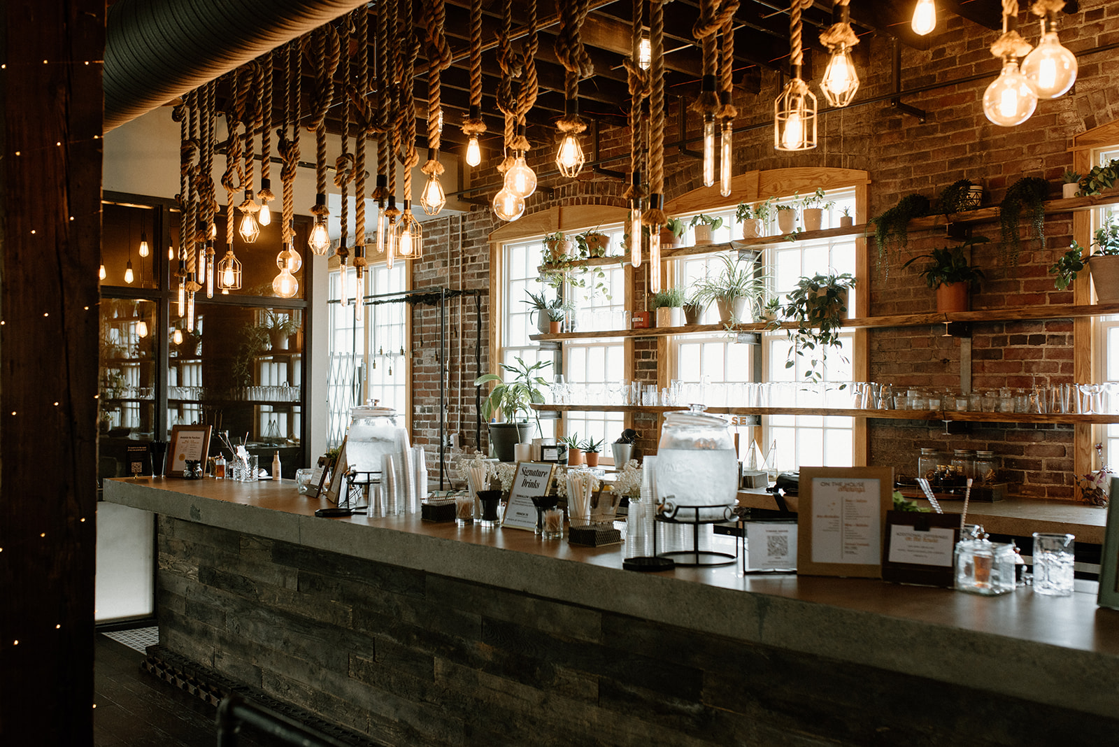 Custom bar with rope lighting and concrete bartop
