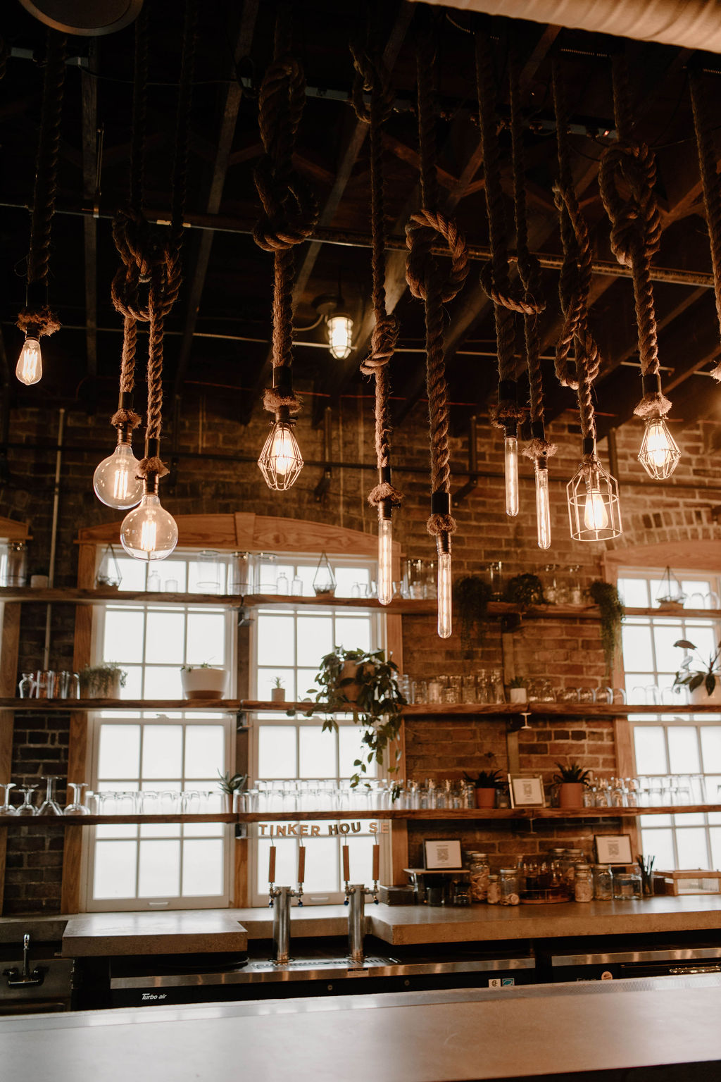 Tinker House wedding bar with rope lighting and concrete bartop